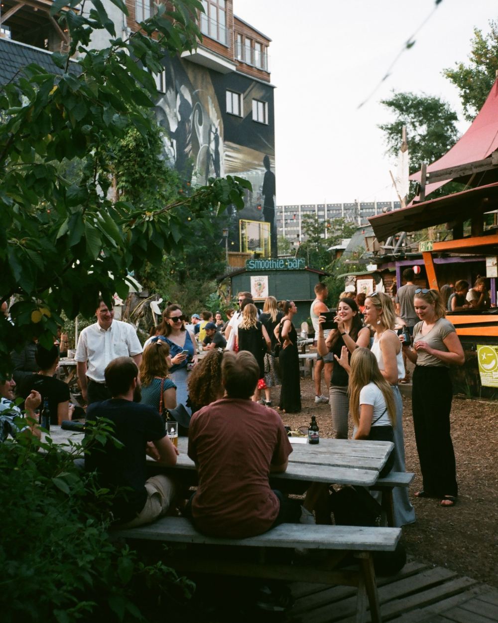 An evening in a Berlin beer garden, benches under string lights