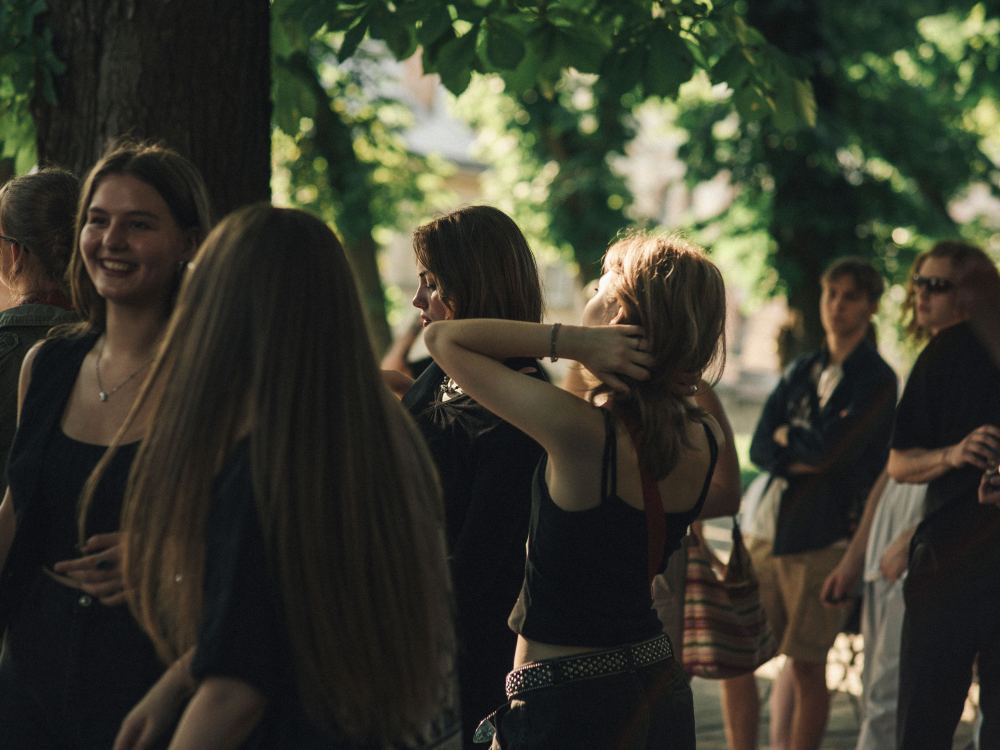 Standing together outdoors at the group's summer gathering
